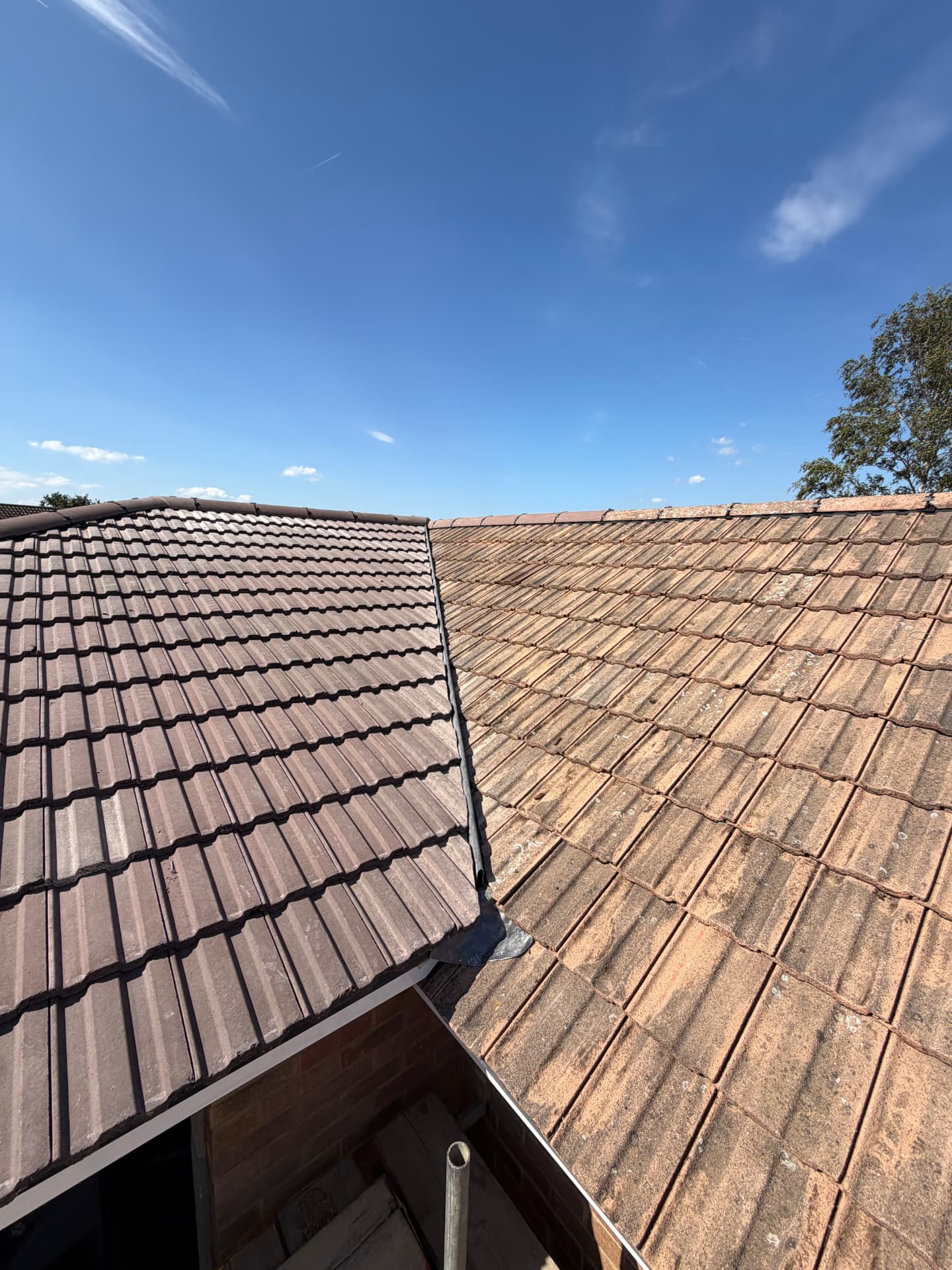 Close-up of the lead valley joining new and existing roof sections