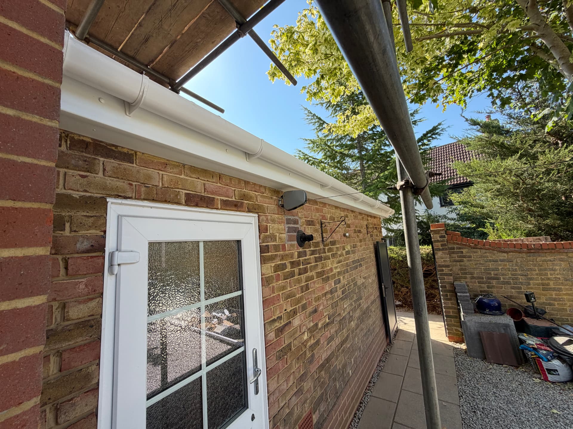 Renewed guttering and fascia above the side door and pathway of the Bracknell property