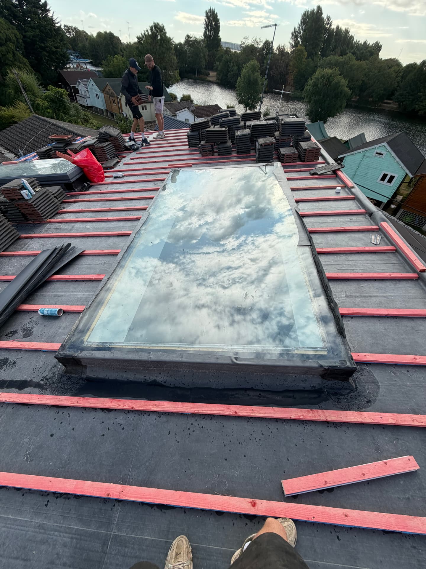 Counter battens fixed over the sealed EPDM around a rooflight