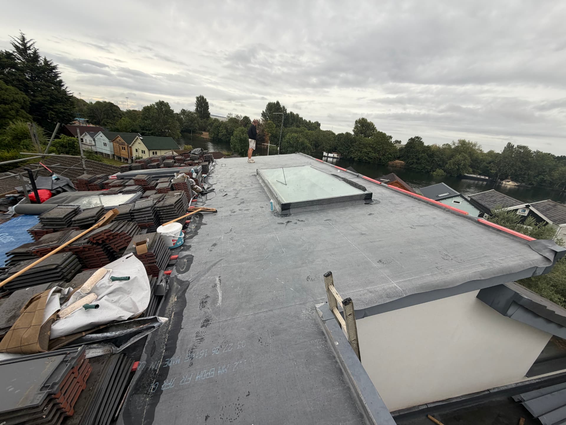 Fully bonded EPDM membrane laid across the low-pitch roof with rooflight detail