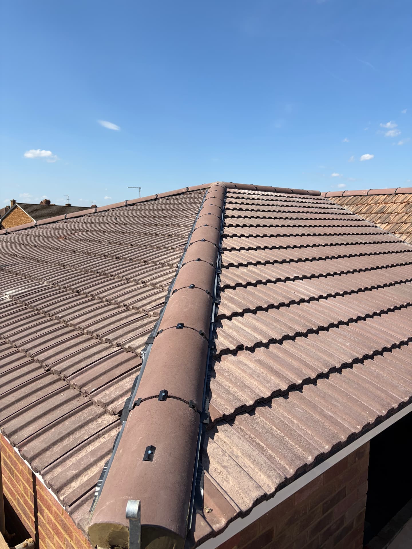 Completed hip roof section showing dry hip unions and ventilated membrane strip